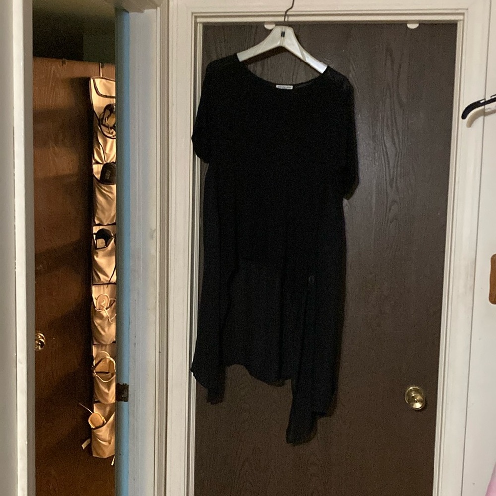Elevated basic long black blouse.